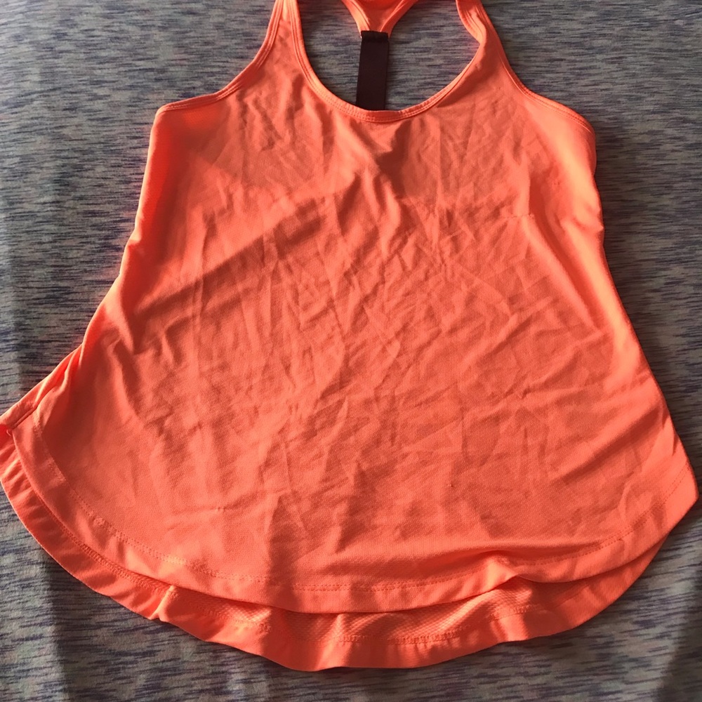 2 athletic shirts one Nike one Reebok